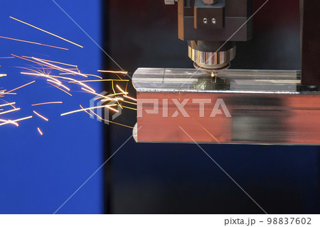 Closeup the fiber laser cutting machine cutting machine cut the square stainless steel tube. Closeup the fiber laser cutting machine cutting machine cut the square stainless steel tube. 98837602