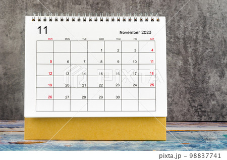 The November 2023 Monthly desk calendar for 2023 year on wooden table. 98837741
