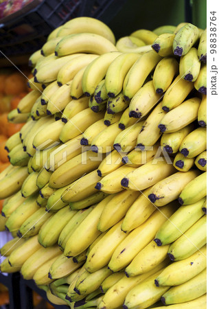 Bananas on the market. Harvest of yellow ripe bananas is sold at the farmer's eco market. 98838764