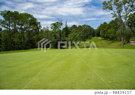 Beautiful golf course in a sunny day. Background evening golf course has sunlight shining down. Golf course in the countryside Beautiful golf course in a sunny day. Background evening golf course has sunlight shining down. Golf course in the countryside 98839157