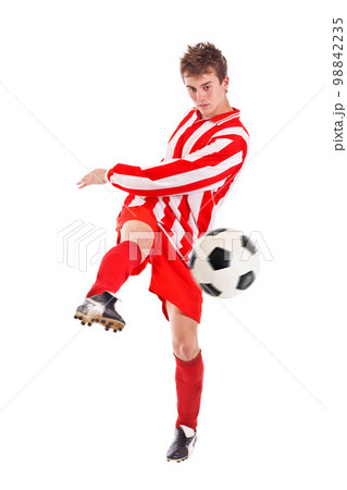 Soccer player shooting a ball 98842235