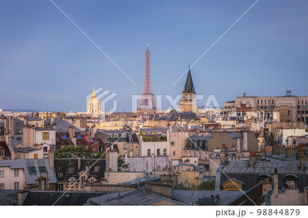 Eiffel Tower and french roofs architecture from above at sunrise, Paris, France Eiffel Tower and french roofs architecture from above at sunrise, Paris, France 98844879