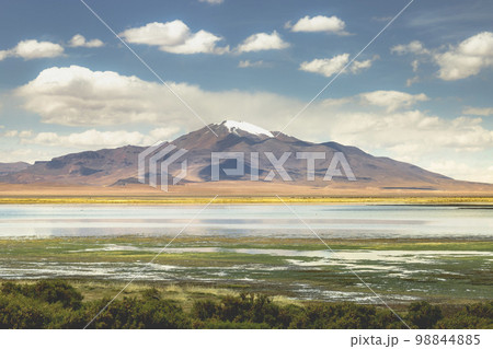 Salt lake, volcanic landscape at Sunset, Atacama, Chile border with Bolivia 98844885