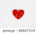 Valentine's Day concept. Red heart with the light string on the white wooden background. 98847319