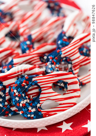 American flag. Red, white, and blue chocolate-covered pretzel twists. American flag. Red, white, and blue chocolate-covered pretzel twists. 98847626