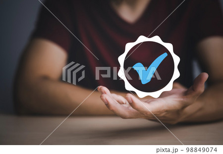 Quality assurance of business services, Businessman Hand shows the sign of the top service Quality assurance in Black background , Guarantee, Standards, ISO certification and standardization concept. Quality assurance of business services, Businessman Hand shows the sign of the top service Quality assurance in Black background , Guarantee, Standards, ISO certification and standardization concept. 98849074