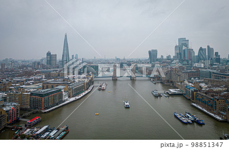 London and Tower Bridge over River Thames on a foggy day - LONDON, UK - DECEMBER 20, 2022 London and Tower Bridge over River Thames on a foggy day - LONDON, UK - DECEMBER 20, 2022 98851347