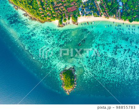 Aerial view of Sunrise beach with long tail boats in Koh Lipe, Satun, Thailand Aerial view of Sunrise beach with long tail boats in Koh Lipe, Satun, Thailand 98855783