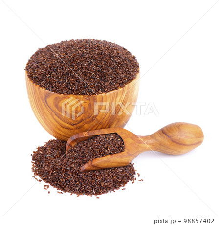 Psyllium seeds in wooden bowl and spoon, isolated on white background. Plantain. Plantago psyllium. 98857402