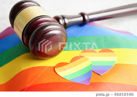 Gavel for judge lawyer with heart rainbow flag, symbol of LGBT pride month. 98858590