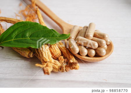 Ginseng roots and green leaf, healthy food. 98858770