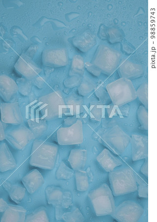 Rotating blue background with ice cubes and water drops. High quality 4k footage 98859743