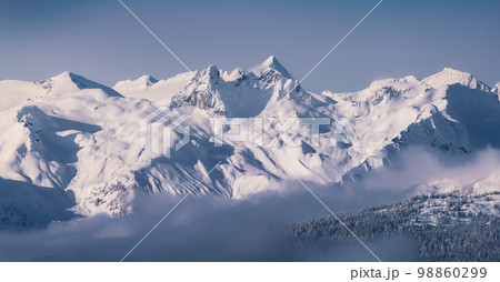 Snow and Cloud covered Canadian Nature Landscape Background. Whistler 98860299