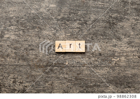 art word written on wood block. art text on cement table for your desing, concept 98862308