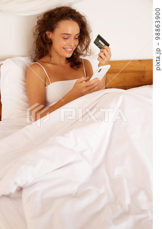 Happy Woman Having Online Shopping. Smiling Lady Typing Credit Card Details Happy Woman Having Online Shopping. Smiling Lady Typing Credit Card Details 98863900