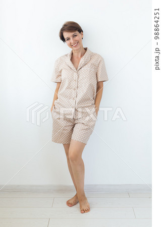 Woman wears pajama. Close-up detail and fabric texture of a pajama. Homewear, sleepwear, shopping and sale Woman wears pajama. Close-up detail and fabric texture of a pajama. Homewear, sleepwear, shopping and sale 98864251