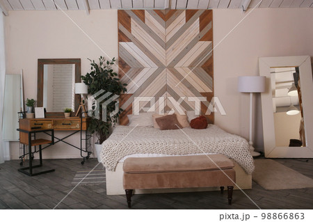 fragment modern wooden bedroom with, pillow, bed cover on wooden wall background fragment modern wooden bedroom with, pillow, bed cover on wooden wall background 98866863