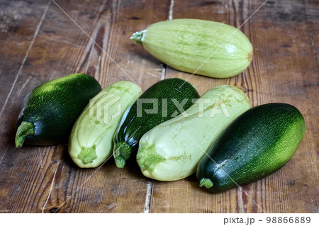 Freshly harvested crop of fresh zucchini is on table. Freshly harvested crop of fresh zucchini is on table. 98866889