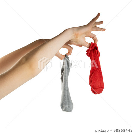 Hand Holding Dirty Socks Isolated, Laundry, Household Chores Concept, Smelly Sock Hand Holding Dirty Socks Isolated, Laundry, Household Chores Concept, Smelly Sock 98868445