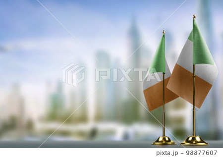 Small flags of the Ireland on an abstract blurry background Small flags of the Ireland on an abstract blurry background 98877607
