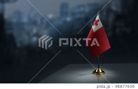 Small flags of the Tonga on an abstract blurry background 98877630