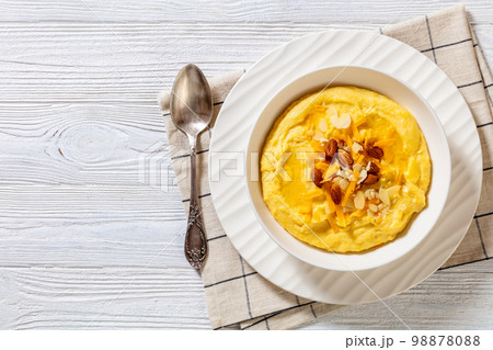 corn grits with butter, vegan cheese, and almonds 98878088