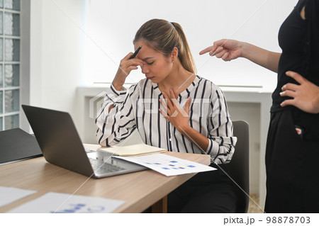 Stressed woman gets scolding from angry irritated company boss. Emotional pressure, stress at work 98878703