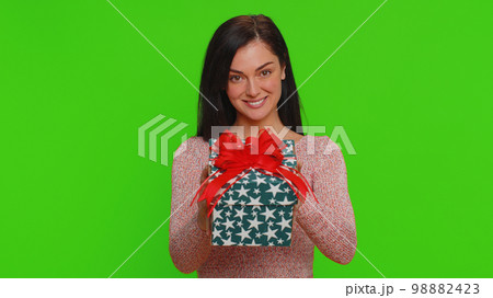 Woman presenting birthday gift box stretches out hands, offer wrapped present career celebrate bonus Woman presenting birthday gift box stretches out hands, offer wrapped present career celebrate bonus 98882423