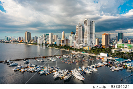 Cityscape of Manila. It is the capital of the Philippines, is a densely populated bayside city on the island of Luzon 98884524