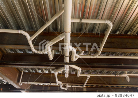 Installation of assembled in waste pipe lines system under ceiling an apartment building complex Installation of assembled in waste pipe lines system under ceiling an apartment building complex 98884647