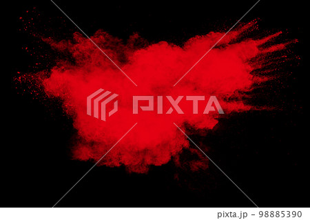 Red powder explosion cloud on black background. Freeze motion of red color dust  particle splashing. 98885390