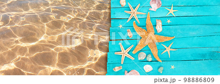 Starfish, shells on wooden blue boards of pier with clear water of sea with sand. Vacation, travel, beach. Banner. Copy space Starfish, shells on wooden blue boards of pier with clear water of sea with sand. Vacation, travel, beach. Banner. Copy space 98886809