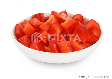 slices of red sweet bell pepper in ceramic bowl isolated on white background with full depth of field 98889378