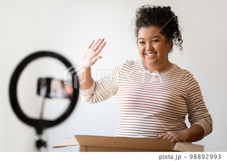 Happy mixed race young woman plus size shooting vlog Happy mixed race young woman plus size shooting vlog 98892993