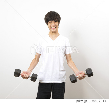 teen boy training with barbells on white background. healthy lifestyle. dieting for athletics. teen boy training with barbells on white background. healthy lifestyle. dieting for athletics. 98897014