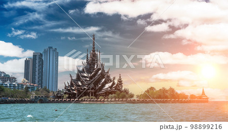 Sanctuary of Truth. Beautiful Landmark view of sculpture of Sanctuary of Truth temple with sunset sky background in Pattaya, Chonburi, Thailand. Sanctuary of Truth. Beautiful Landmark view of sculpture of Sanctuary of Truth temple with sunset sky background in Pattaya, Chonburi, Thailand. 98899216