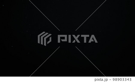 sparks like particles floating in air over black background sparks like particles floating in air over black background 98903343