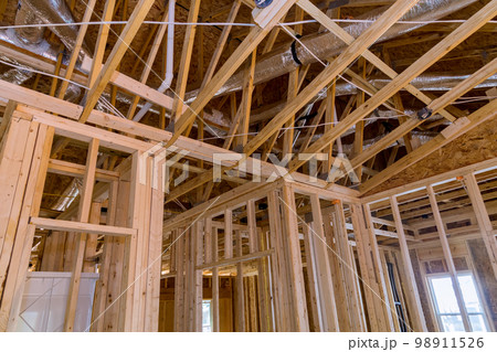 Framing beams, wood sticks all communication lines must be installed first for newly constructed house before plasterboard is applied plumbing 98911526