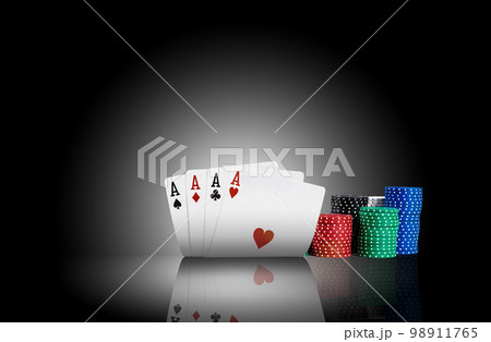 Four aces standing on a mirror surface with a backlight, ahead of a colorful chips in piles. Black background. Gambling entertainment. Close-up. Four aces standing on a mirror surface with a backlight, ahead of a colorful chips in piles. Black background. Gambling entertainment. Close-up. 98911765