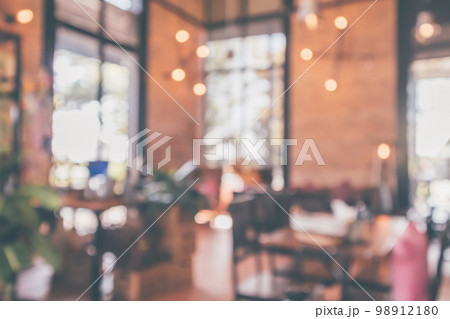 Restaurant cafe or coffee shop interior with customer blur abstract vintage style bokeh light for montage product display background 98912180