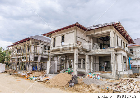 construction residential new house in progress at building site 98912718