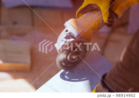 In order to prepare for laying floor tiles contractor is required cut ceramic tiles into individual pieces before they are laid 98914902