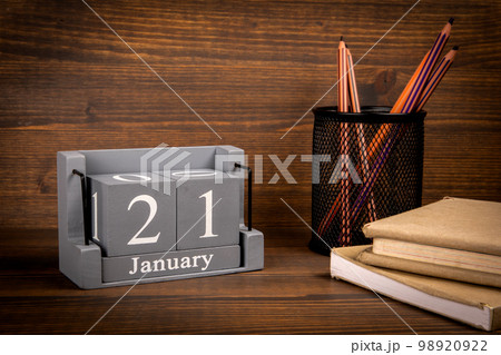 21 January inscription on wooden calendar. Wooden office desk 98920922