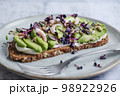 Toast with avocado on plate 98922926