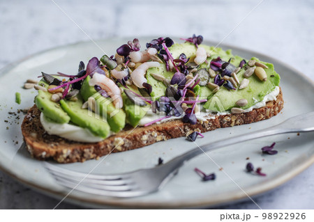 Toast with avocado on plate 98922926