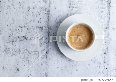 Espresso cup on grey background Espresso cup on grey background 98922927
