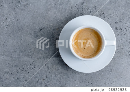 Espresso cup on grey background Espresso cup on grey background 98922928