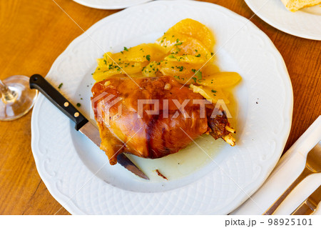 Popular dish of Spanish cuisine is Toston asado Popular dish of Spanish cuisine is Toston asado 98925101