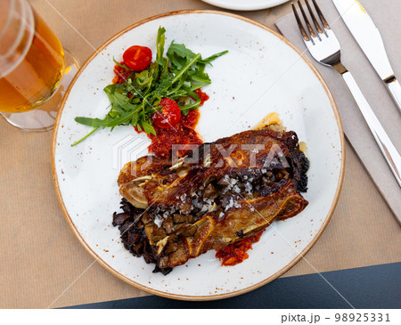 Appetizing meat dish Terrine of pork ears and kidneys with red pesto sauce 98925331
