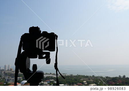 black digital camera shooting city landscape 98926083